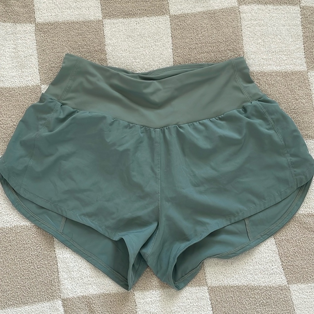 Green running shorts